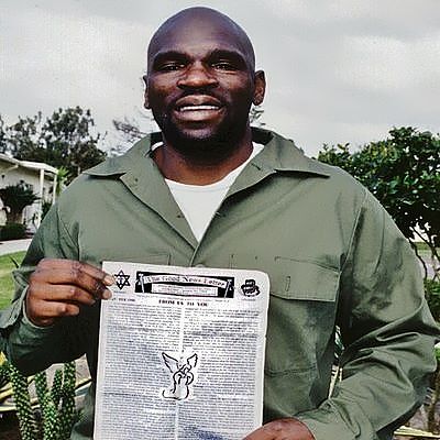 Michael Sellers holding “The Good News Letter”