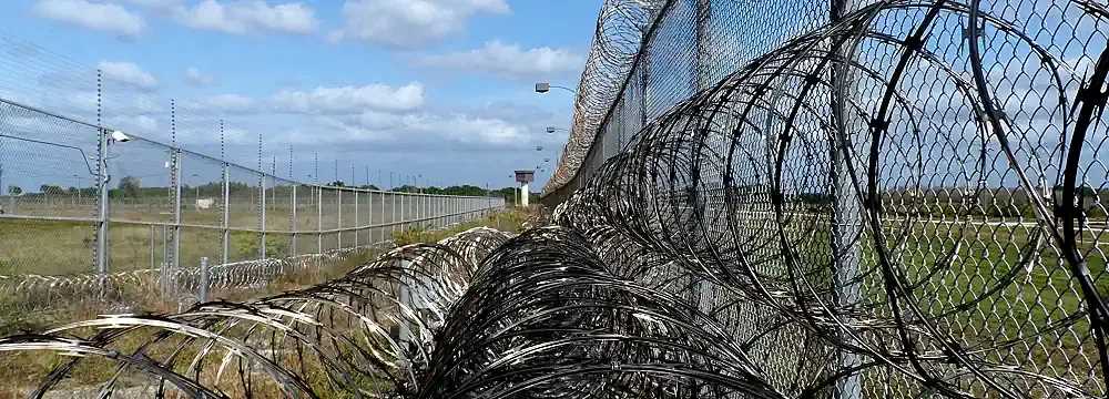 Prison fence and barbed wire